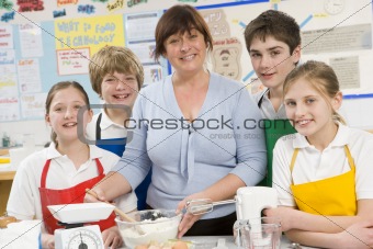 Schoolchildren and teacher at school in a cooking class