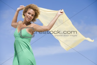 Young woman holding scarf