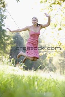 Young woman in summer meadow