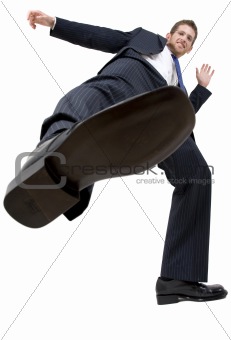 businessman kicking