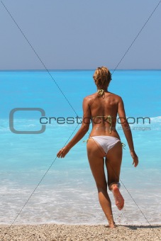 Pretty blonde woman enjoying the Ionian sea in Greece