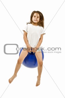 young girl on a space hopper