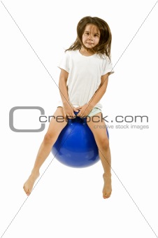 young girl on a space hopper