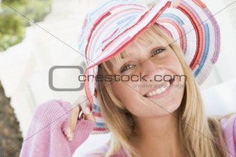 Young woman wearing straw hat