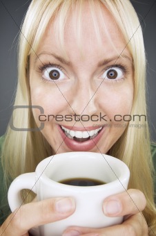 Beautiful Woman Enjoys Coffee