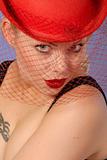pretty girl with sensual expression, wearing red hat