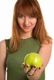 Fitness girl with green apple, focus on fruit