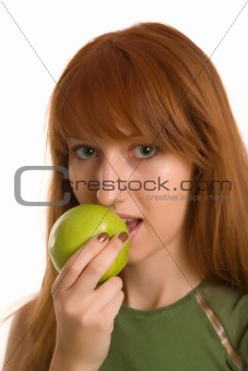 Red-haired girl with green apple