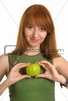 Sensual girl holding apple like a heart