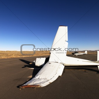 Broken plane on tarmac at airport.