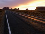 Sunset on highway in Monument Valley.
