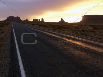 Sunset on highway in Monument Valley.