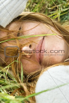 Female resting in grass.
