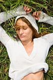 Woman lying in grass.