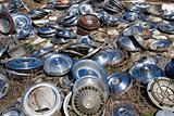 Old hubcaps on ground