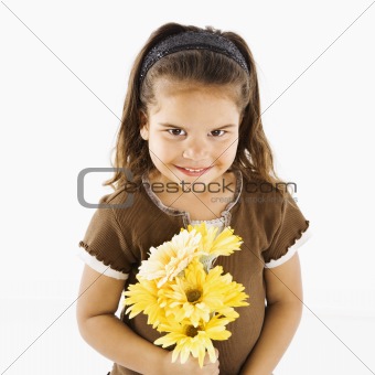 Cute little hispanic girl with bouquet.