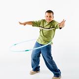 Boy using hula hoop.