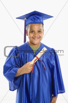 Young hispanic boy graduating.