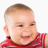 Smiling hispanic male baby.