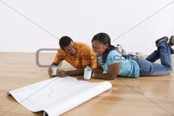 Couple with blueprints.