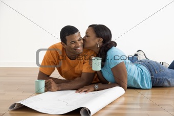Woman kissing man.