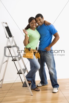 Portrait of couple with ladder.