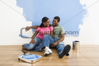 Couple relaxing while painting.