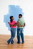 Man and woman looking at paint job.