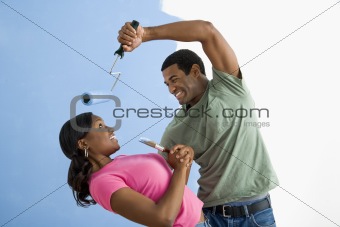 Man being playful with woman.