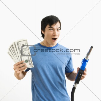 Man with money and gas nozzle.