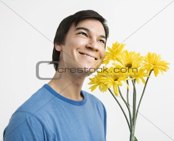 Man holding bouquet.
