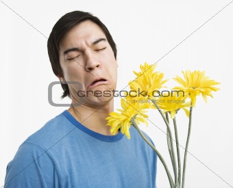 Unhappy man holding bouquet.