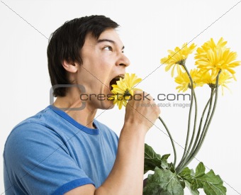 Man eating bouquet.