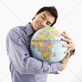 Man hugging globe