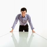 Businessman standing at table