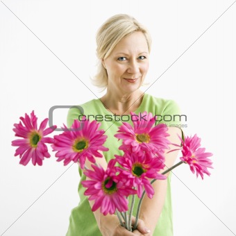 Woman giving flowers.