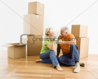 Couple with moving boxes.