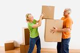 Man and woman moving boxes.