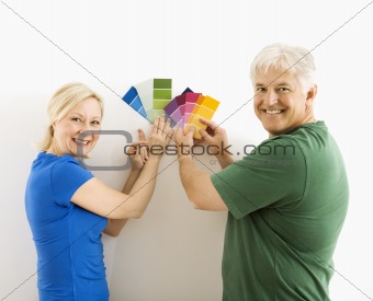Man and woman comparing swatches.