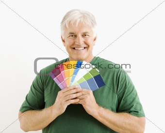 Man with paint swatches.