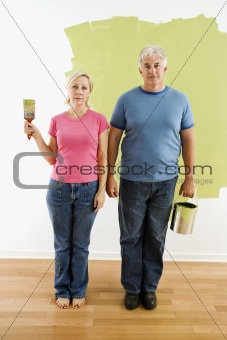 Couple with painting utensils.