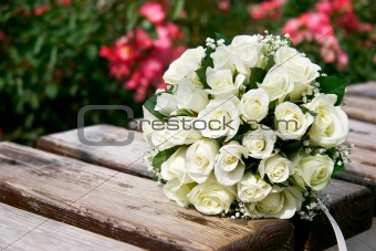 close up of wedding bouquet on wooden bench