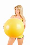 winking girl with a ball for fitness