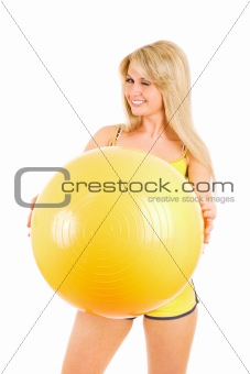 winking girl with a ball for fitness