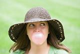 Young Woman Blowing a Bubble