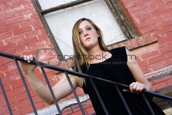 Beautiful Girl posing outdoors on stairs in the City