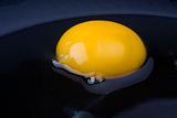 egg yolk in a black pan