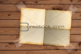 Sheet paper, hanging on a wooden wall