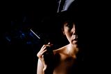 Woman in shadow wearing a black hat