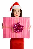 Young Asian woman in Christmas hat with huge gift